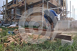 Cutting bricks with an angle grinder in a rural yard