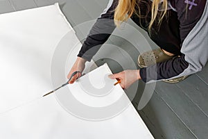 Cutting of canvas using scissors