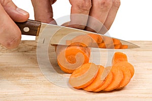 Cutting carrots on the board
