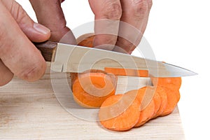 Cutting carrots on the board