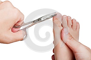 Cutting child toenail photo
