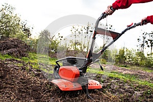 Cutting-edge agricultural technology at play: the tiller meticulously tills the untouched soil, setting the stage for