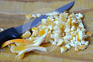 Cutting fresh orange fruit peels