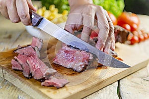 Beef steak cut on chopping board
