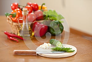 Cutting healthy food fresh cucumber on hardboard