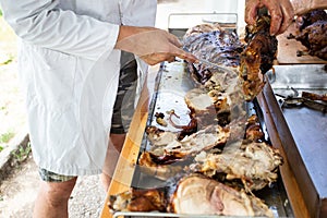 Cutting of home grilled baby pork