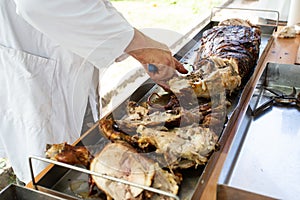 Cutting of home grilled baby pork