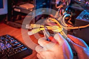 Cutting the Internet cable tied into a knot with wire cutters. Disconnecting the Internet and restricting access