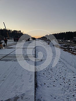 Cutting joints in concrete in winter.