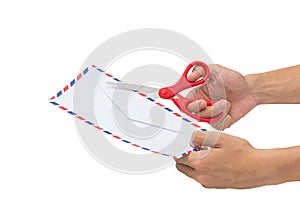 Cutting a letter, Opening an envelope with scissors isolated