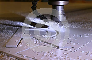 Cutting the letters of the alphabet from plastic on a milling machine
