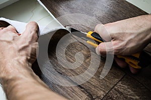 Cutting of linoleum and floor coverings photo