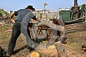 Cutting logs on a steam powered saw