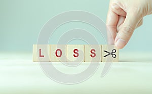 Cutting losses concept. Cut or eliminate the loss to protect gains, limit losses on a security position.