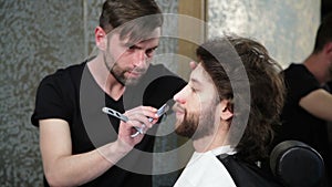 cutting man's beard with the straight razor