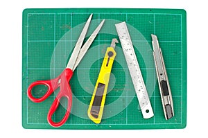 Cutting mats with scissors ruler and cuter on white background