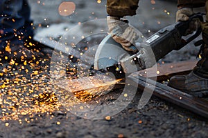 Cutting metal with angle grinder.