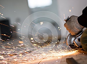Cutting metal with angle grinder.