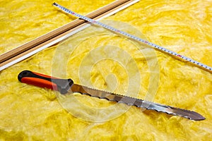 Cutting mineral wool for house insulation