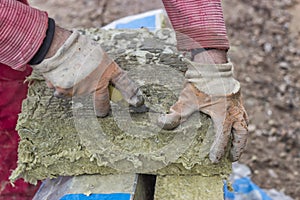 Cutting mineral wool panel with a craft knive 3 photo