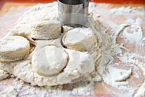 Preparing biscuits on floured surface photo