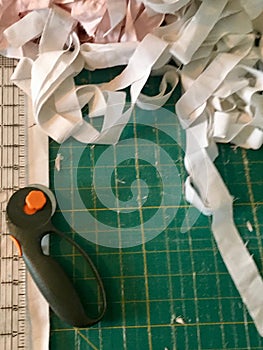 Cutting Pad, Fabric Scraps, Rotary Cutter and Ruler