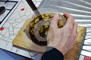 Cutting of pineapple using knife