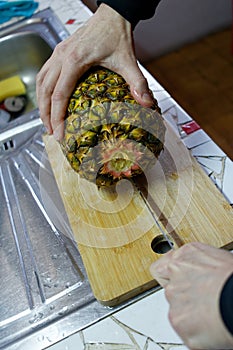 Cutting of pineapple using knife