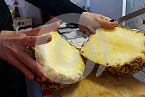 Cutting of pineapple using knife