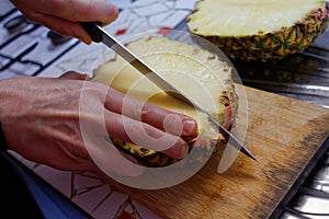 Cutting of pineapple using knife