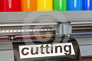 Cutting plotter close-up. The process of cutting a vinyl film photo