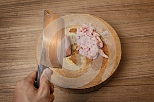 Cutting Raw pork meat on cutting board