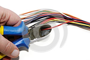 Cutting red cable with nippers photo