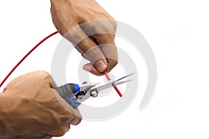 Cutting red cable with nippers