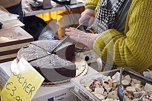 Cutting a sachertorte cake.