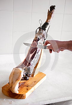 Slicing Jamon in the kitchen photo