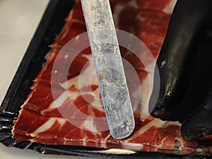 Cutting spanish iberic cured ham