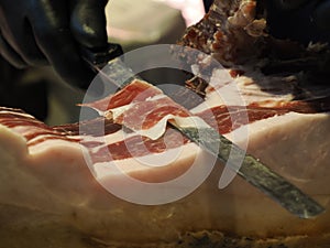 Cutting spanish iberic cured ham