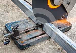 Cutting a square metal and steel with compound mitre saw