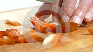 Cutting sweet pepper to cook the recipe