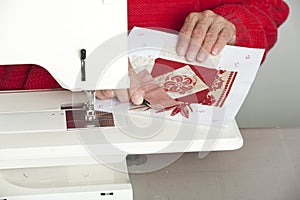 Cutting thread from fabric.