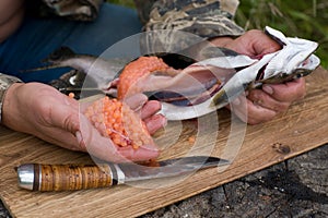 Cutting up fresh-caught salmon