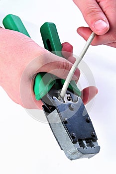 Cutting an utp cable with a network tool.Stages Of The Process