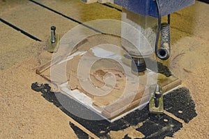 Cutting wood on a CNC milling machine close-up