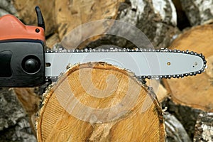 Cutting wood with gas chain saw