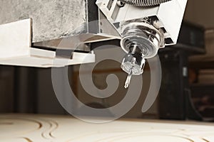 Cutting wood using a machine with numerical control. Cnc tool.