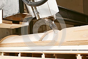 Cutting wood using a machine with numerical control. Cnc tool.