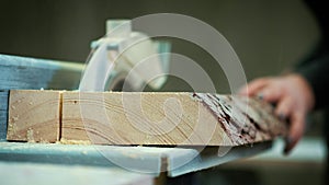 Cutting wood at a wood factory. Close up clips of sawing wood. A sawmill is a facility where logs are cut into lumber.