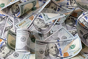 cuved U.S. 100 dollar banknotes background