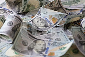 cuved U.S. 100 dollar banknotes background